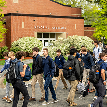 Students walking outside. Links to What to Give