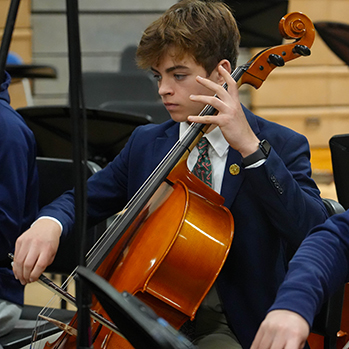 A student playing the cello. Links to Gifts of Life Insurance