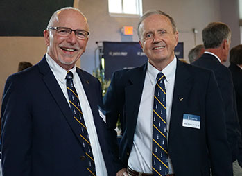 Two men smiling. Link to Life Stage Gift Planner Ages 60-70 Situations.