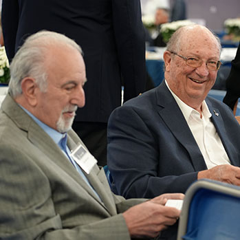Alumni sitting at table during luncheon. Links to Gifts from Retirement Plans