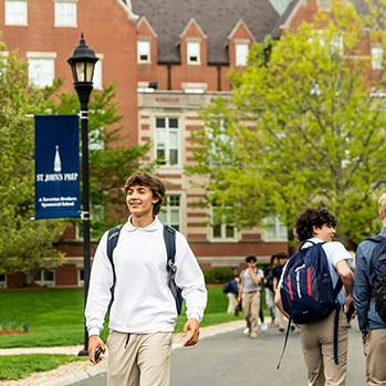 Students walking outside. Links to Gifts of Real Estate