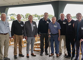 A group of men smiling. Link to Life Stage Gift Planner Over Age 70 Situations.